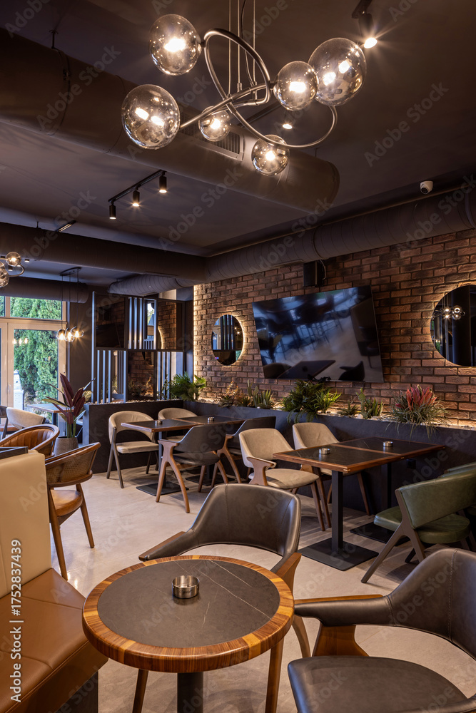 Fototapeta premium Modern hotel dining room prepared for guests