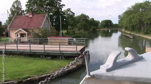 Tour Boat Gliding Past Sörby Lock House on Göta Canal, Sweden