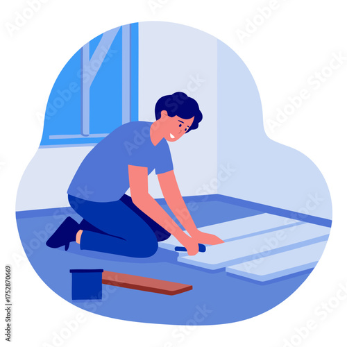 Young man laying laminate flooring in a bright room  