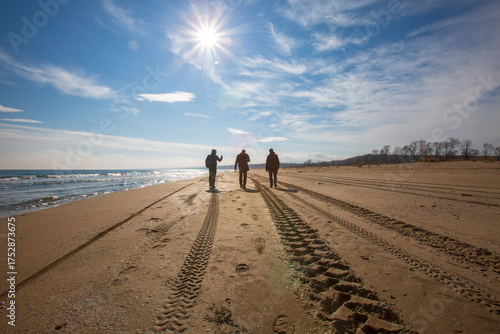 Fototapeta Naklejka Na Ścianę i Meble -   walking on the beach, people silhouette, visual