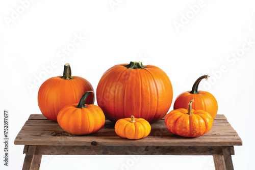 Fresh ripe pumpkins on wooden table cutouts