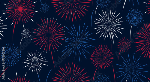 Festive fireworks display in red, white and blue on dark navy background