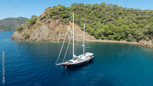 Wallpaper Mural A breathtaking summer day with a gulet ship floating gracefully on turquoise waters. Torontodigital.ca