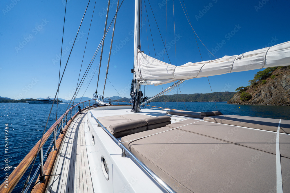Fototapeta premium Below deck view of a handcrafted wooden sailboat interior.