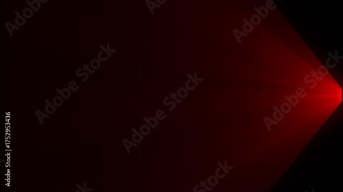 Green light beam emanating from the top against a dark background