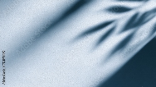 Subtle shadows cast on a textured surface, creating an artistic play of light and dark tones