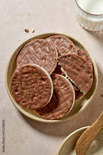 Tableau sur toile plate of rice galettes cakes cookies covered with milk chocolate