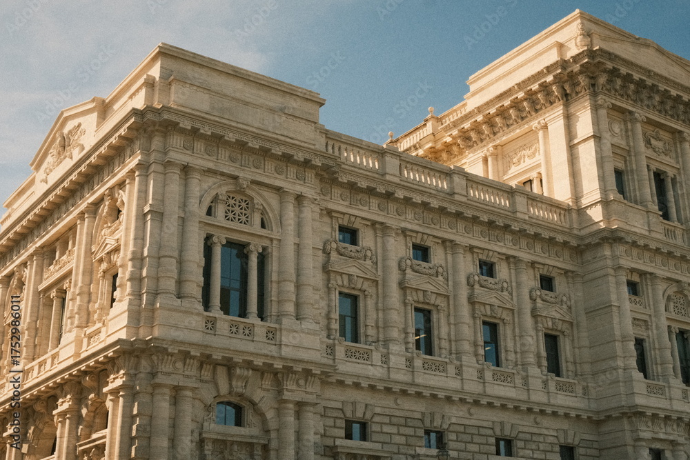 Obraz premium Facade of a monumental historic building with neoclassical details in Rome, Italy. Elegant architecture, cultural heritage, and travel concept.