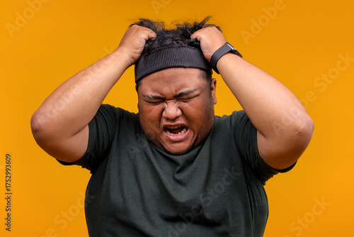 Frustrated Fat Man in Sportswear Pulling Hair Feeling Overwhelmed by Stress and Pressure