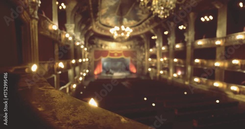 Wallpaper Mural The beautifully crafted interior of a theater features ornate decor, chandeliers, and a view of the stage set for a performance. Ambient lighting creates a warm, inviting atmosphere. Torontodigital.ca