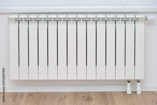 Wallpaper Mural White aluminum radiator with thermostat for home heating. Indoor heating system for apartment or house. Energy efficiency concept. Torontodigital.ca