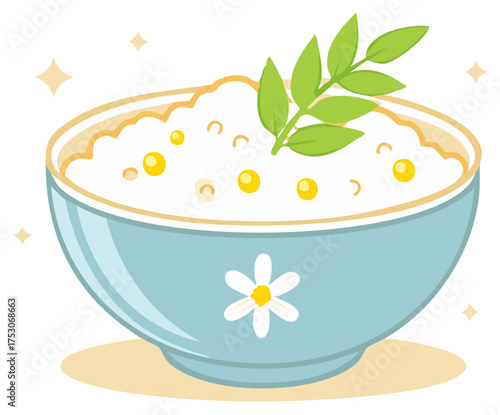 Wholesome breakfast bowl filled with porridge and topped with fresh green leaves and berries