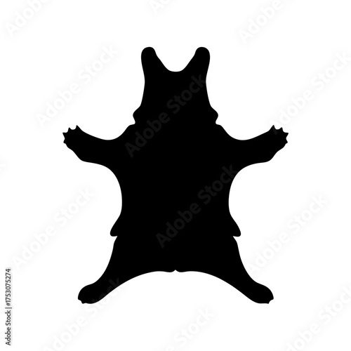 Silhouette of a black bear skin rug displayed with outstretched paws and head facing forward