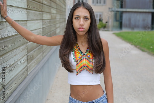 Native American girl with traditional colorful outfit 