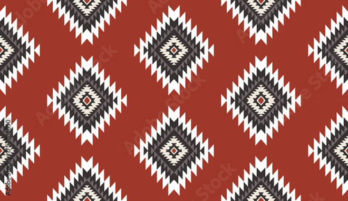 Seamless geometric ethnic pattern inspired by Native American tribal fabric. Traditional Aztec and Navajo style carpet and tile vector design on navy blue background. Perfect for textile, wrapping,