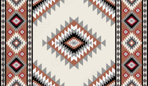 Seamless geometric ethnic pattern inspired by Native American tribal fabric. Traditional Aztec and Navajo style carpet and tile vector design on navy blue background. Perfect for textile, wrapping,