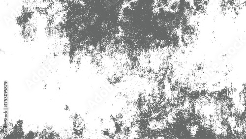 A textured background with irregular gray speckles scattered across a white surface.