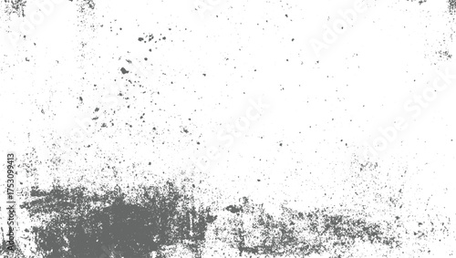 A white surface with scattered gray speckles and larger distressed areas.