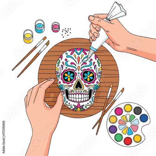 Hands painting a colorful sugar skull design on a wooden board with artistic tools and paints nearby in a creative workspace.