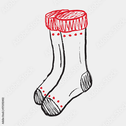 Hand drawn pair of winter socks with red cuffs, dotted accents. Vector sketch illustration in vintage crayon textured style. Cozy winter clothes, christmas decoration
