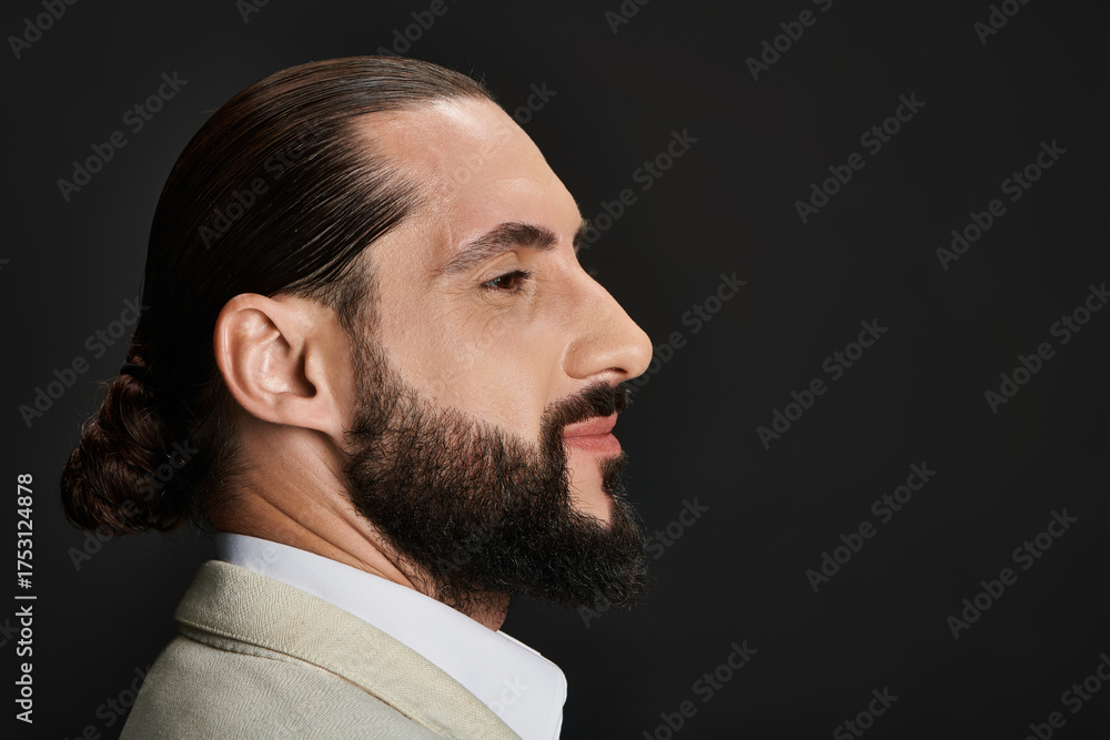 Obraz premium Handsome middle eastern man showcasing contemporary fashion in studio setting