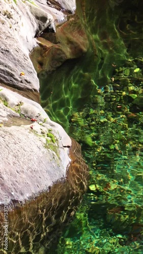 Calm, clear waters with rock formations