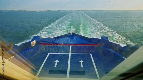 The ferry moves along the sea