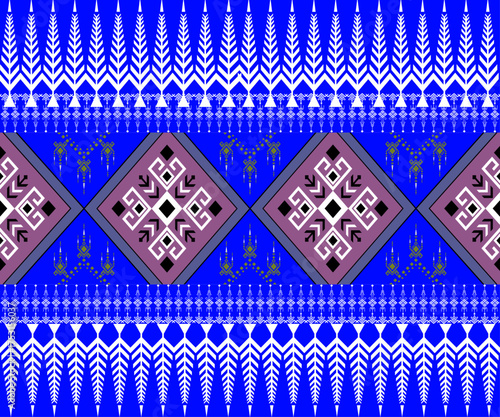 This image shows a traditional Thai fabric pattern with blue and white tones, featuring diamond shapes and intricate geometric designs.
