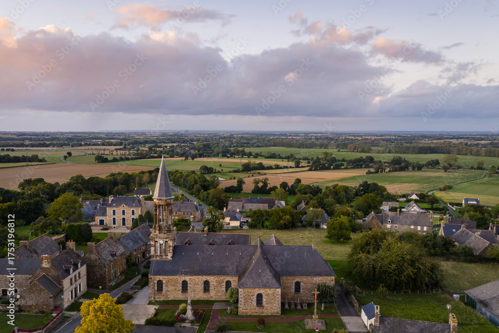 Fototapeta premium Sunset Over Charming French Village Sougeal, Brittany, France