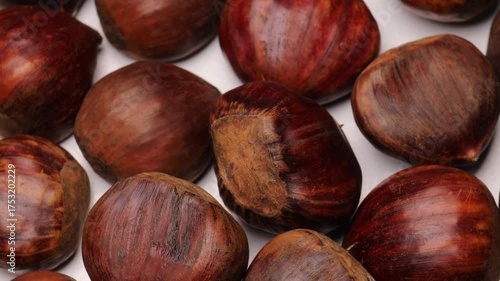Brown chestnuts, rotation in circle. Chestnuts show natural texture and glossy shell, Turning.