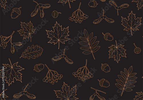 Golden autumn leaves scattered on a dark background