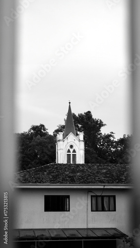 Church Spire Above Residential Roof