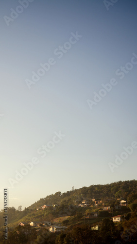 Houses on Sunny Hillside Horizon