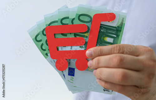 Hand holding euro banknotes...