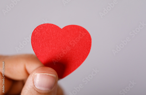 A hand gently holds a vibra...