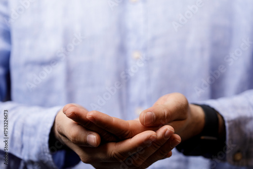 Close-up of a man's hands h...
