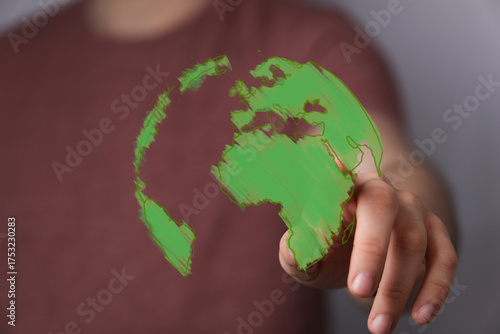 A person's hand interacts w...