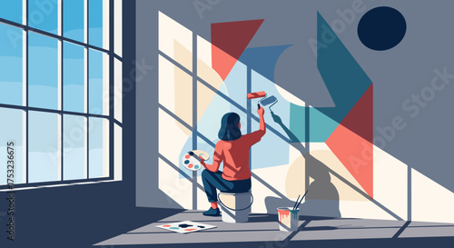A person painting abstract geometric shapes on a wall inside a sunlit room.
