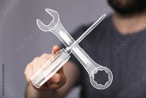 Hand holding digital wrench...