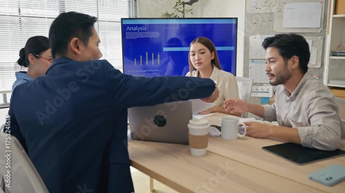 Group of creative Businesspeople brain storm meeting presentation,discussing roadmap to product launch, planning,strategy,dashboard,new business development,working with new startup project in office