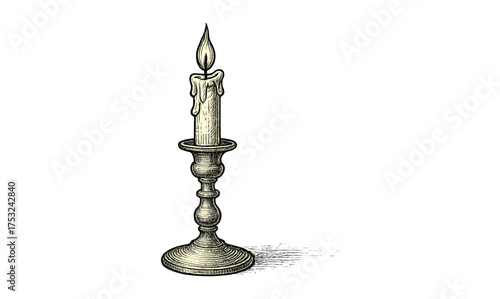 Vintage engraved candle on holder with dripping wax in classic style