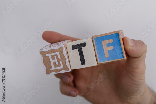 A hand holding wooden block...