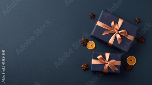 Elegant gift box presents for holiday celebration on dark blue festive background. flat lay top view composition with copy space for special christmas greeting