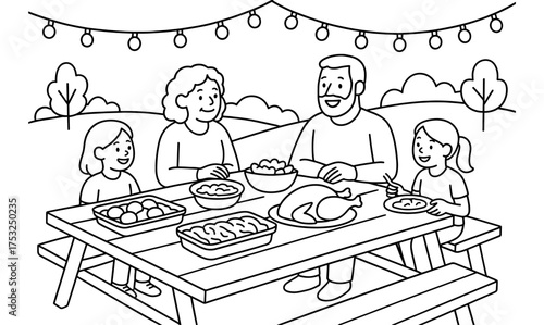 Family enjoying festive outdoor picnic with delicious food under string lights