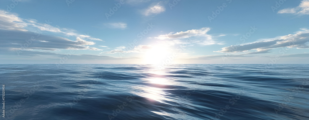 Obraz premium Serene ocean view under a bright blue sky, showcasing calm waters and gentle waves reflecting sunlight.