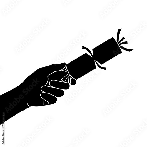 Hand holding Christmas cracker ready to be pulled for celebration  