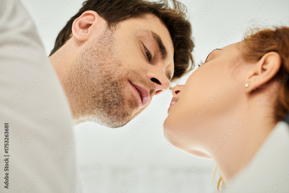 Fototapeta premium Joyful couple sharing intimate moments at home on a relaxing weekend together