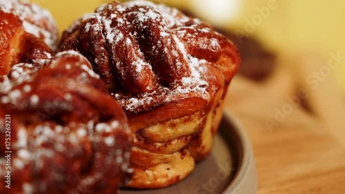 Freshly baked cinnamon rolls in a cozy cafe setting