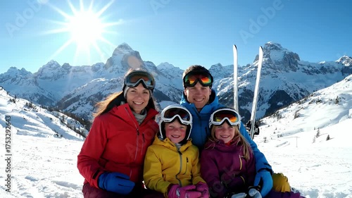 Happy Family Ski Vacation In Snowy Mountains