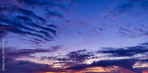 Colorful clouds and sky in the morning,Real majestic sunrise sundown sky background with gentle colorful clouds without birds. Panoramic, big size.